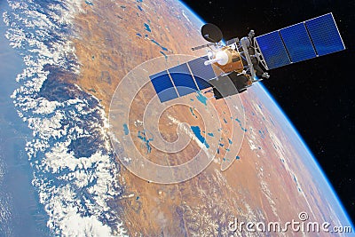 Low-orbit communication satellite in space above the Earth. Elements of this image furnished by NASA Stock Photo