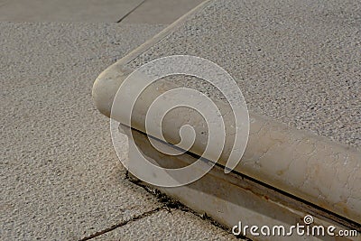 low riser comfortable exterior beige stone stair of one riser Stock Photo