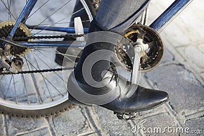 Low section of businessman riding bicycle on street Stock Photo