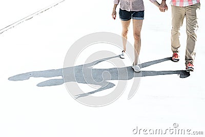 Low section of couple walking on street Stock Photo