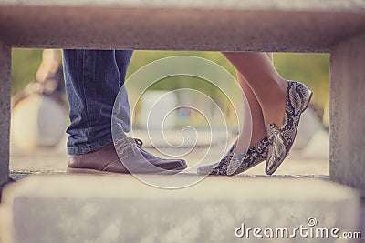 Low section, cropped image couple standing in stylish shoes in a park , close to each other Stock Photo