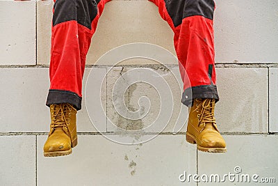 Person on construction site wearing workwear Stock Photo