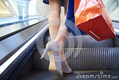 Low section of woman with shopping bags Stock Photo