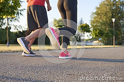 Low section of young couple running Stock Photo