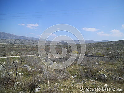 A low stone wall with stairs in the wildness. Stock Photo