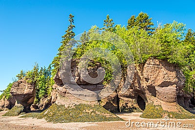 Low tide in Bay of Fundy with fascinating rock formations - Canada Stock Photo