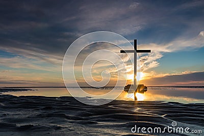 Low Tide Cross Sunset Stock Photo