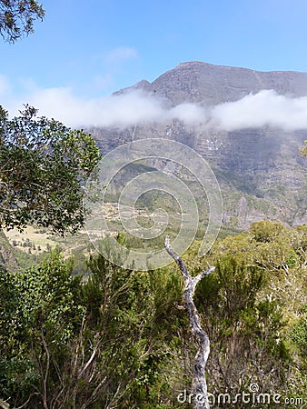 Low white cloud of the circle of Mafate in the Reunion Island. Stock Photo