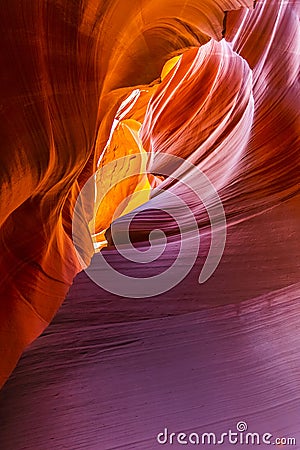 Lower Antelope Canyon`s Wave-curved rock maze with changing light and shadow. Stock Photo