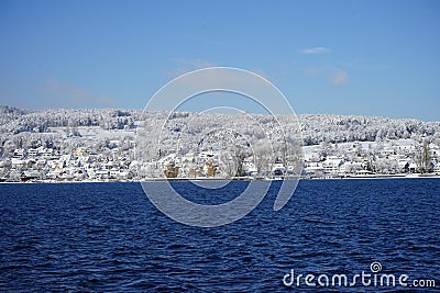 Lower part of Lake Constance seen from the freshly snow-covered shore of Steckborn in Switzerland Stock Photo