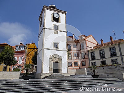 View of the port and the church of the small town of Luanco in Asturias, Spain. Europe. Editorial Stock Photo