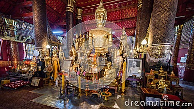 Luang Prabang, Laos - December 3, 2015: Buddha statue at Wat Mai Suwannaphumaham, Luang Prabang, Laos. Editorial Stock Photo