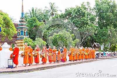 Buddhist monks collecting alms in the morning in Luang Prabang, Laos. Stock Photo