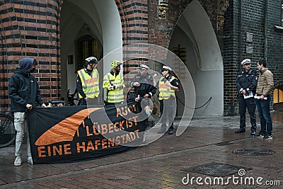 Lubeck, Germany, September 09, 2020: Police und demonstrators in preparation talk for the demonstration march in Luebeck against Editorial Stock Photo