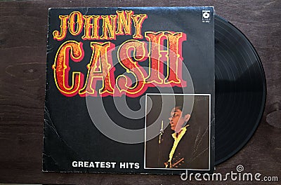 Lublin, Poland. 18 January 2023.Johnny Cash Greatest Hits long play on dark wooden table Editorial Stock Photo