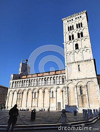 Lucca, Italy. The church of San Michele in Foro, Chiesa di San Michele in Foro. View to the bell tower. Editorial Stock Photo