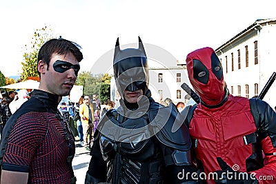 Cosplayers at the Lucca Comics masked by Batman & Robin and Deadpool Editorial Stock Photo