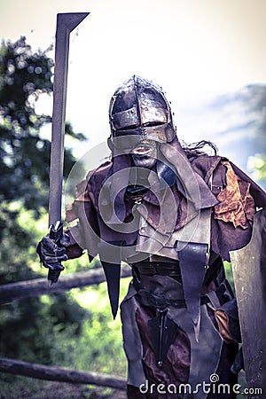 Lucca, Italy - 2018 10 31 : Uruk-hai warrior with helmet and sword from the lord of the rings Editorial Stock Photo