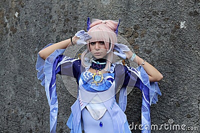 Cosplayer girl dressed as Sangonomiya Kokomi, character from the video game Genshin Impact. Editorial Stock Photo