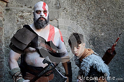Two Cosplayers, father and son dressed as Viking warriors at the Lucca Comics and Games 2022 cosplay event. Editorial Stock Photo