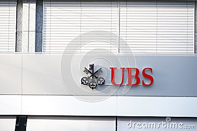 Close up view on Logo of a Swiss bank UBS on the facade of a building. Editorial Stock Photo