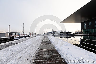 Lucerne, Switzerland, February 4, 2019: The culture and congress center KKL in Lucerne with a snowy footpath on a winter day Editorial Stock Photo