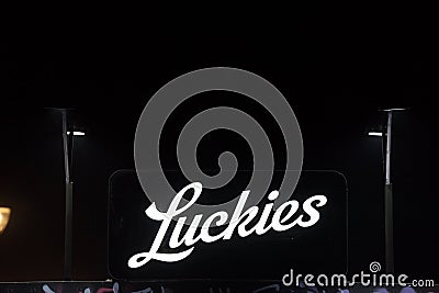 Luckies, the vintage name for Lucky Strike logo in front of their retailer in belgrade. Editorial Stock Photo