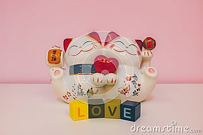 Lucky cat representing love Stock Photo