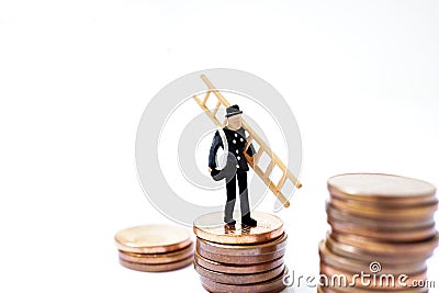 Lucky charm, chimney sweep with ladder stands on coins as a symbol of happiness for prosperity and wealth Stock Photo