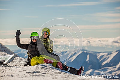Lucky couple snowboarders Stock Photo