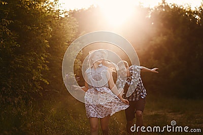 Lucky guy with a girl running in summer Stock Photo