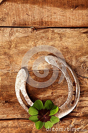 Lucky horseshoe and Irish shamrock Stock Photo