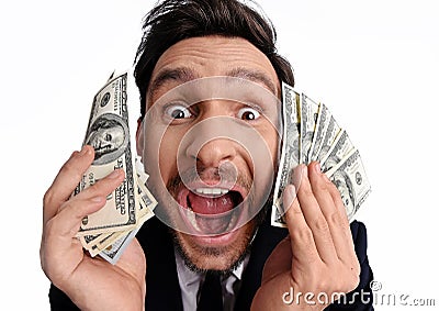 Lucky man holding 100 dollar bill money in his hand Stock Photo