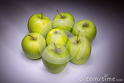 Lucky seven green apples Stock Photo