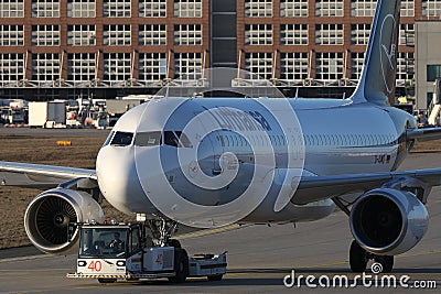 Lufthansa plane being towed in Frankfurt Airport Editorial Stock Photo