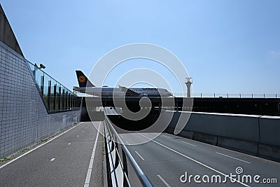 Lufthansa plane taxiing over a bridge Editorial Stock Photo