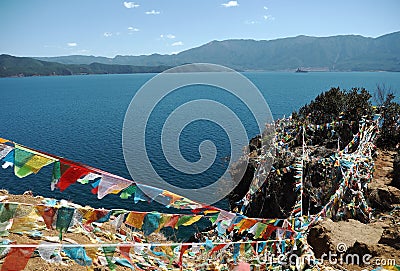 Lugu Lake with Religious Flag Stock Photo