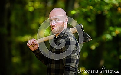 Lumberjack carry ax. Bald woodsman. Harvest firewood. Hike vacation. Hike in forest. Forest care. Determination of human Stock Photo