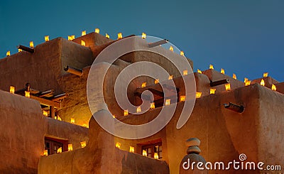 Luminaria on adobe building Stock Photo