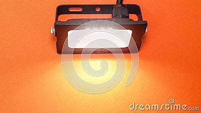 Luminous diode floodlight. Lighting device. Modern energy-saving technologies. Copy space for text Stock Photo