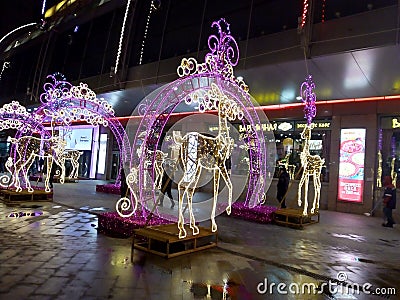 Luminous figures of deer in front of the shopping center Editorial Stock Photo