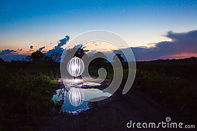 Luminous sphere near the lake Stock Photo