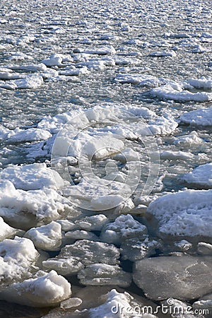 Lumps of snow and ice frazil on the surface of the freezing rive Stock Photo