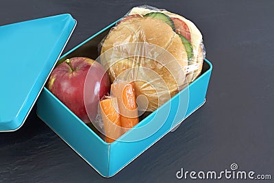 Lunch box , cheese sandwich, apple and carrots Stock Photo