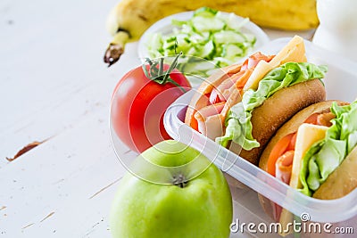 Lunch box with sandwich salad and friuts Stock Photo