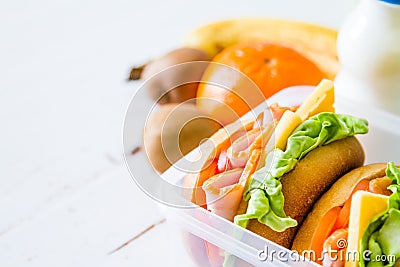 Lunch box with sandwich salad and friuts Stock Photo