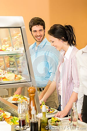 Lunch at canteen office colleagues take salad Stock Photo