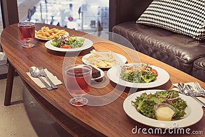 Lunch fresh salads, french fries, fizzy raspberry drinks in the IKEA restaurant at MegaBangna shopping mall Stock Photo