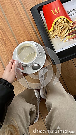 Lunch in McDonald's coffee americano and fries Editorial Stock Photo