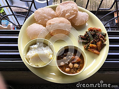 Lunch Plate Puri Pindi Choley Phirni and Aloo Bhindi Sabji Lokgram Kalyan Stock Photo